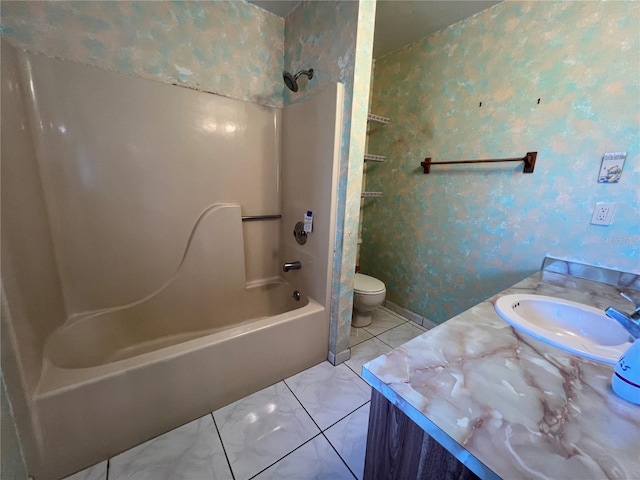 bathroom with wallpapered walls, toilet, tile patterned floors, vanity, and washtub / shower combination