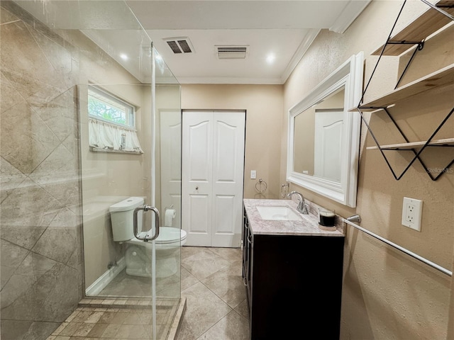 bathroom with a stall shower, visible vents, toilet, vanity, and a closet