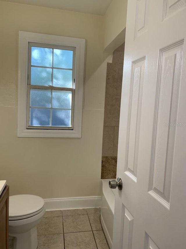 full bathroom with baseboards, toilet, vanity, and tile patterned floors