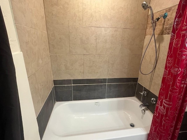 bathroom with shower / bath combo