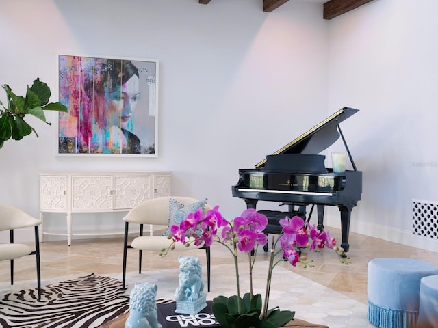 living area featuring tile patterned flooring, beamed ceiling, and baseboards