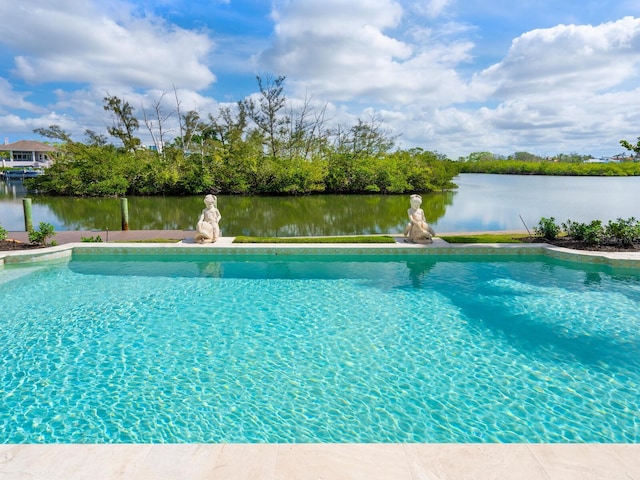 view of pool with a water view and a fenced in pool