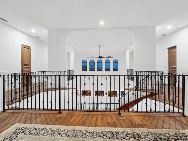 hall featuring visible vents, wood finished floors, and recessed lighting