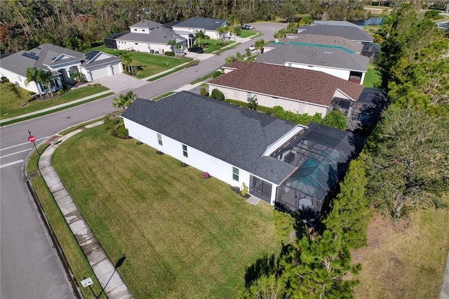 birds eye view of property with a residential view