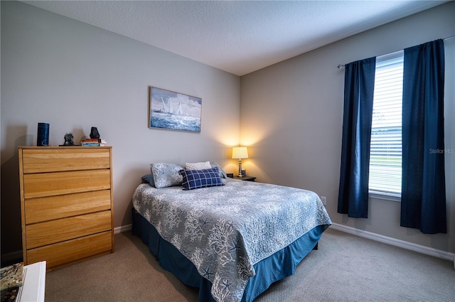 bedroom featuring baseboards, multiple windows, and light colored carpet