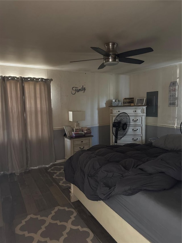 bedroom with electric panel, ceiling fan, and dark wood-style flooring