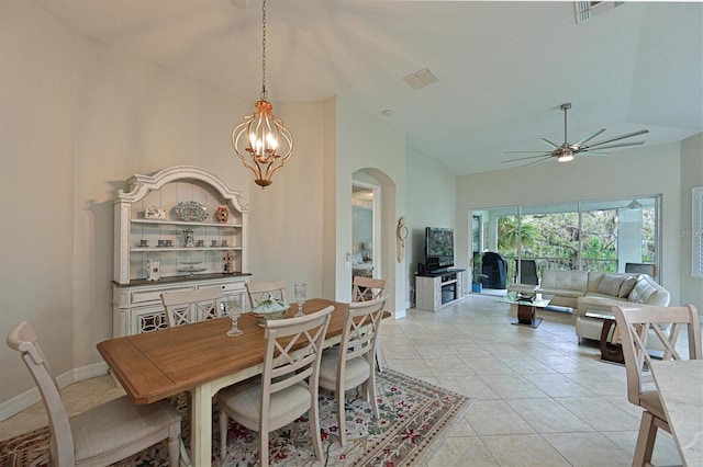 dining area featuring visible vents, vaulted ceiling, baseboards, and light tile patterned flooring