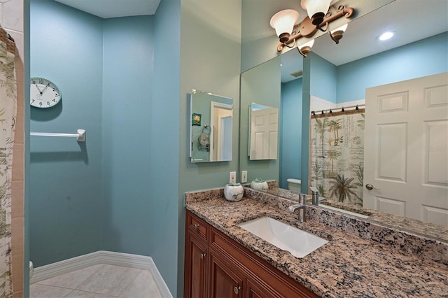 full bath with a shower with shower curtain, toilet, vanity, tile patterned flooring, and baseboards