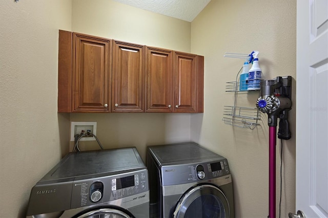 laundry room featuring cabinet space and independent washer and dryer