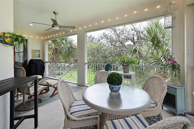 sunroom with a ceiling fan