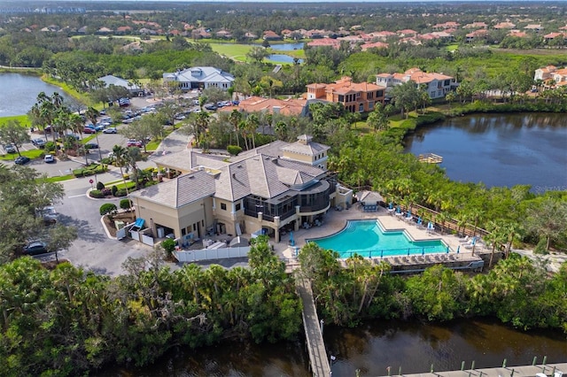 aerial view with a water view and a residential view