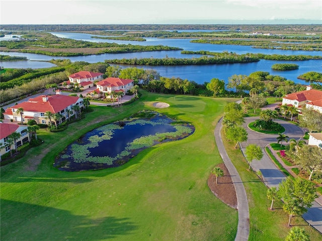 aerial view featuring a residential view, view of golf course, and a water view