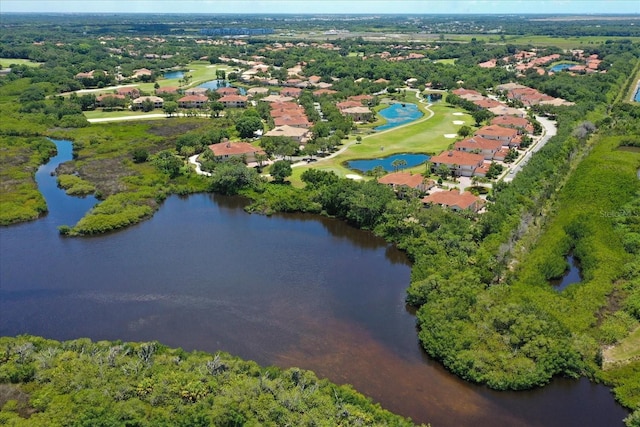 bird's eye view with a water view and a view of trees