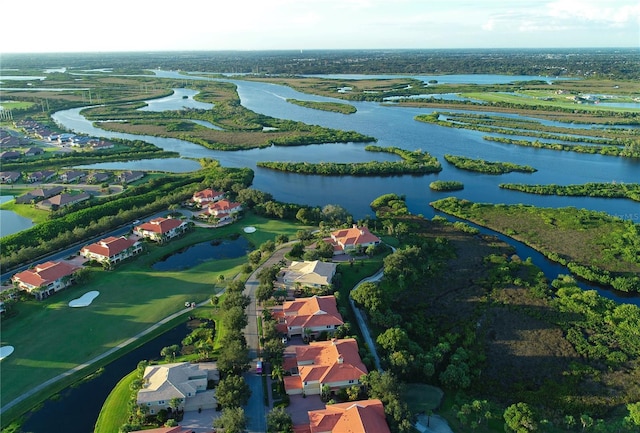 drone / aerial view featuring a water view and a residential view