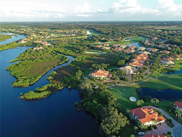 birds eye view of property featuring a water view and a residential view