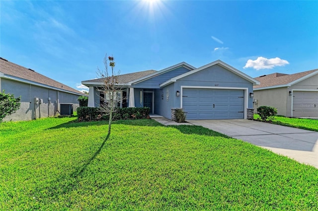 view of front of property with stucco siding, concrete driveway, an attached garage, a front yard, and central AC