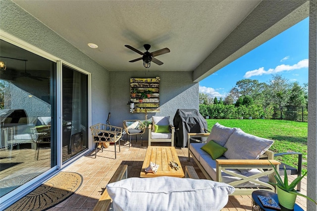 balcony featuring a sunroom, a grill, ceiling fan, and an outdoor hangout area