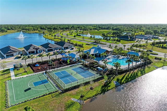 drone / aerial view with a water view and a residential view