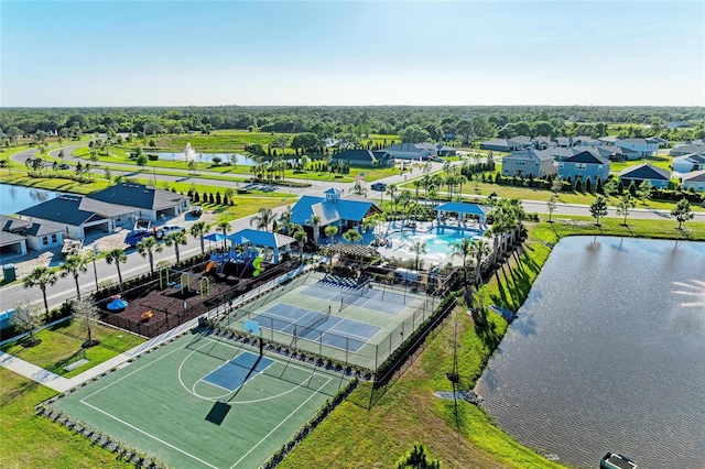 drone / aerial view featuring a water view and a residential view