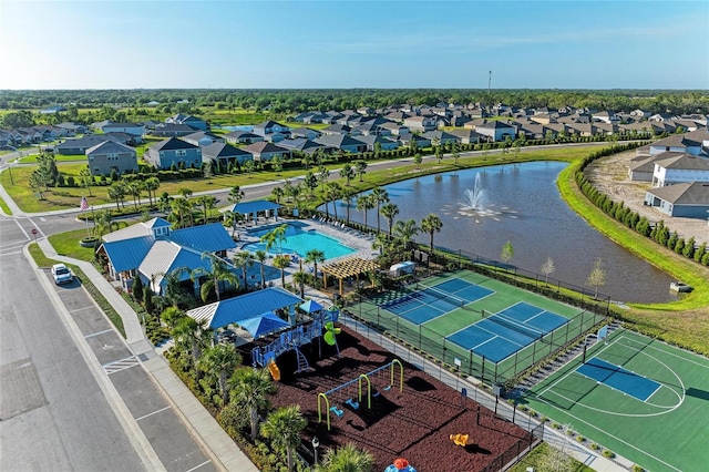 birds eye view of property with a water view and a residential view