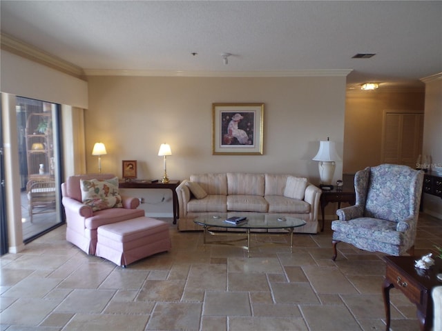 living room with stone finish floor, visible vents, and crown molding