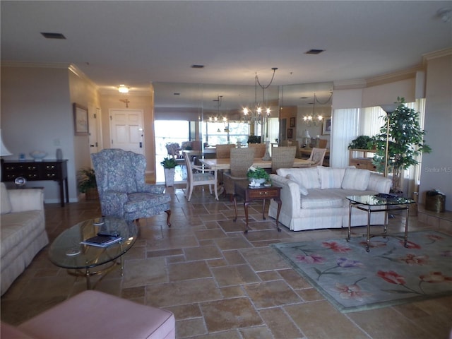 living area with a chandelier, stone finish floor, visible vents, and crown molding