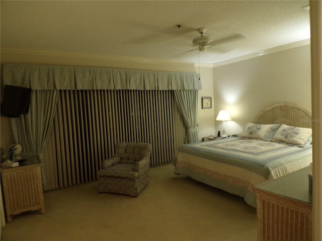 carpeted bedroom with a ceiling fan and crown molding