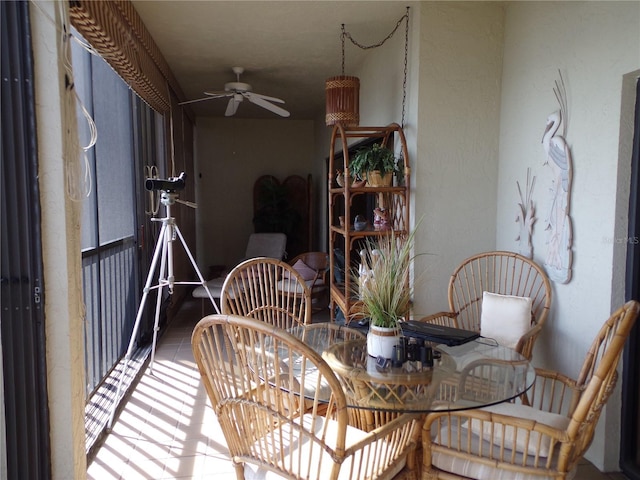 dining space featuring a ceiling fan and tile patterned floors