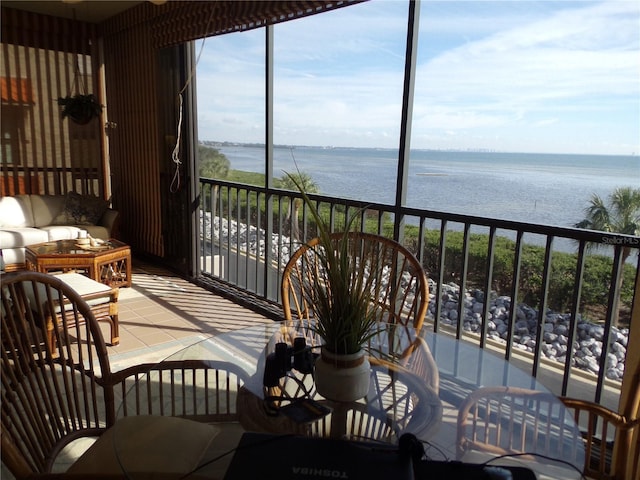 sunroom with a water view