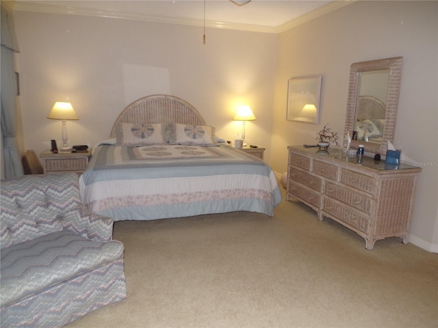 bedroom with ornamental molding and carpet flooring