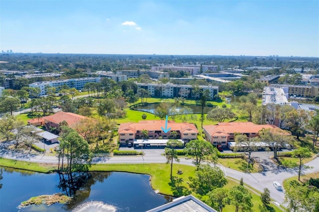 birds eye view of property featuring a water view