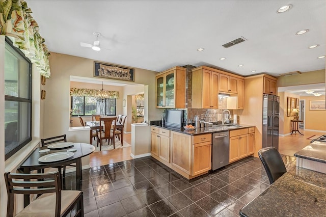 8140 Terrace Garden Dr N Unit 103, Saint Petersburg, FL 33709 - kitchen with stainless steel appliances, a sink, baseboards, ceiling fan, and recessed lighting