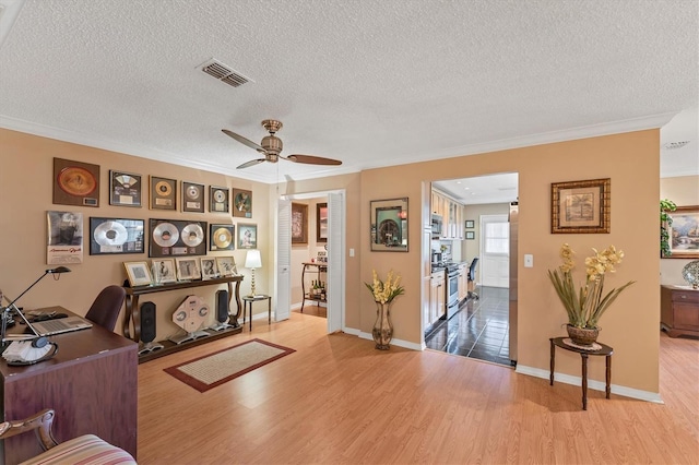 8140 Terrace Garden Dr N Unit 103, Saint Petersburg, FL 33709 - office with wood finished floors, a textured ceiling, ornamental molding, ceiling fan, and baseboards