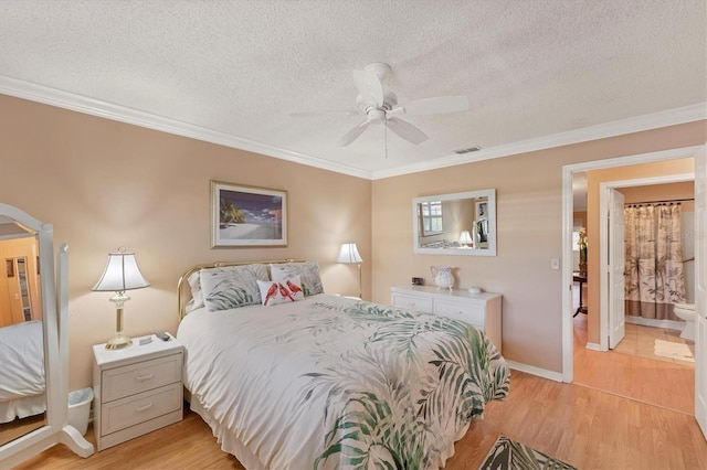 8140 Terrace Garden Dr N Unit 103, Saint Petersburg, FL 33709 - bedroom with a textured ceiling, light wood-style floors, ornamental molding, baseboards, and ceiling fan