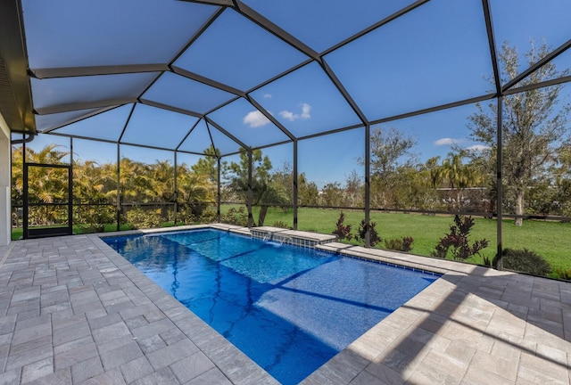 outdoor pool with a lanai, a patio area, and a lawn