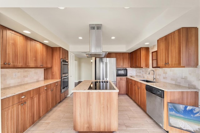 kitchen featuring a sink, light stone countertops, a center island, island range hood, and black appliances