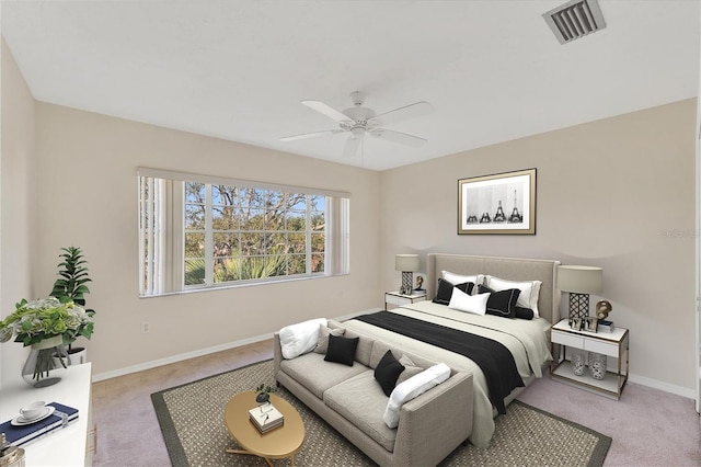 carpeted bedroom with baseboards, ceiling fan, and visible vents