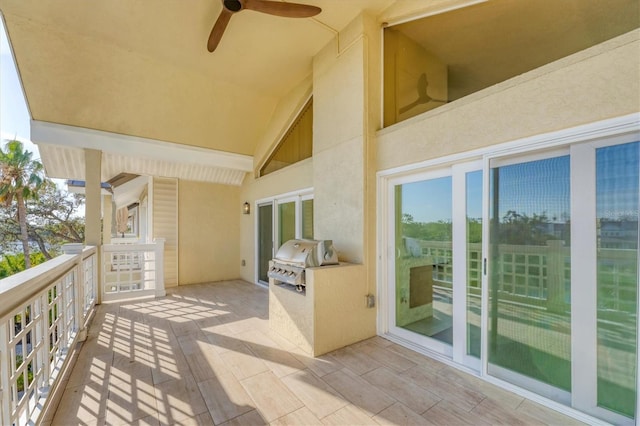 balcony featuring ceiling fan, an outdoor kitchen, and area for grilling