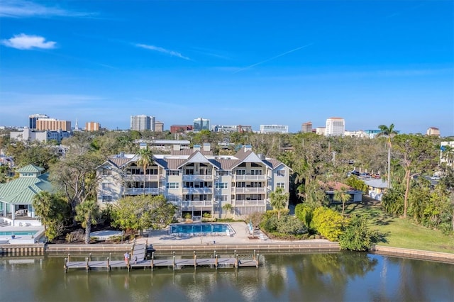 drone / aerial view featuring a water view and a city view