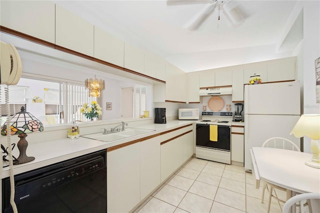 kitchen featuring under cabinet range hood, a sink, white appliances, light countertops, and light tile patterned floors