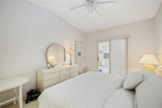 bedroom with vaulted ceiling, carpet flooring, and ceiling fan