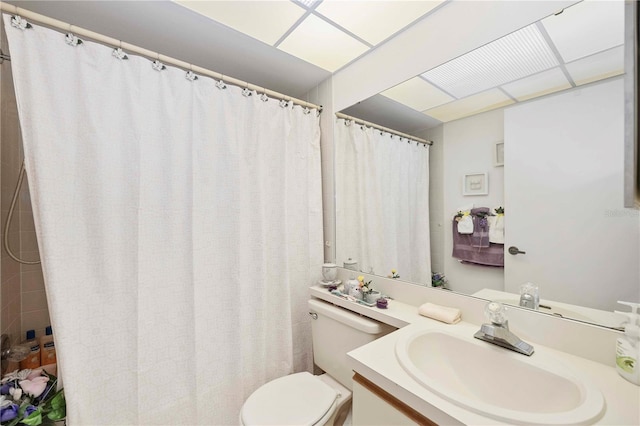 bathroom featuring toilet and vanity