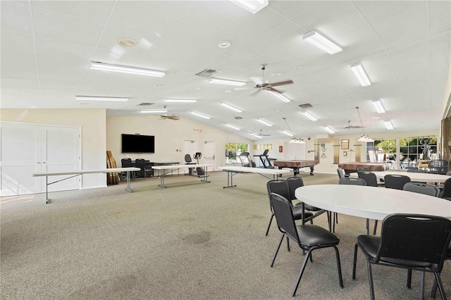 dining area featuring vaulted ceiling, carpet, visible vents, and ceiling fan