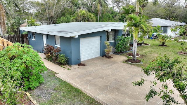 exterior space with driveway and fence