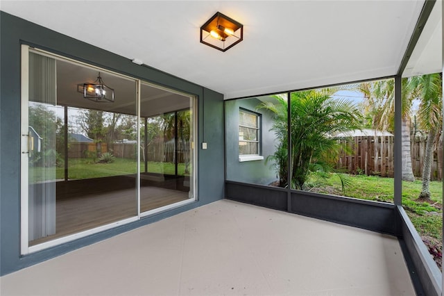 unfurnished sunroom with a wealth of natural light