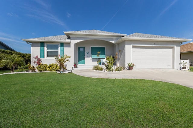 view of front of property with an attached garage, a shingled roof, driveway, stucco siding, and a front yard