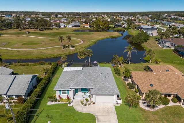 drone / aerial view with a water view and a residential view