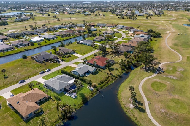 bird's eye view featuring a residential view, view of golf course, and a water view