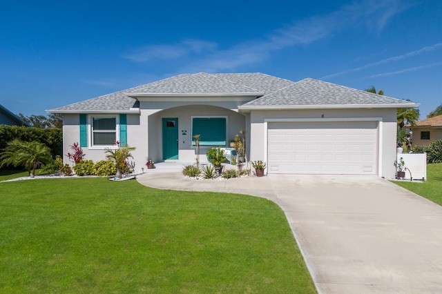 single story home with a garage, driveway, a front lawn, and stucco siding