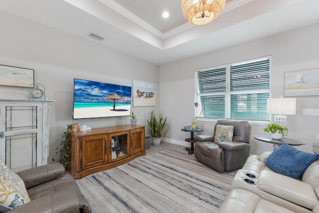 living room featuring crown molding, recessed lighting, a raised ceiling, visible vents, and baseboards